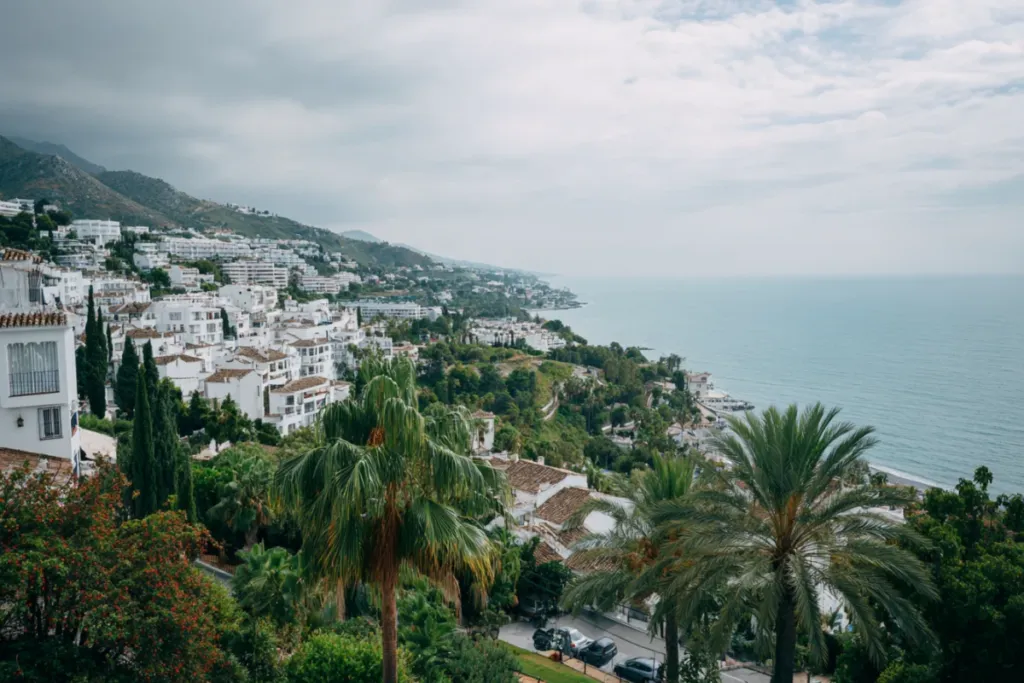 Panoramic view of the Costa del Sol coastline with white Mediterranean towns and blue sea stretching toward the horizon